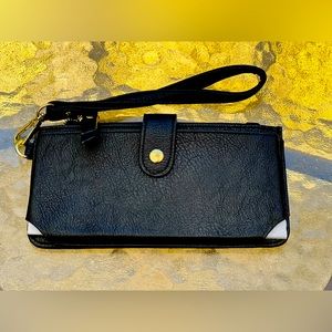 Phone holder wristlet with zipper and card slots. Foam represents mobile phone.